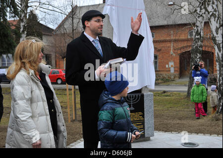 President of the U.S. Commission for the Preservation of American Heritage Abroad Foundation Joan Ellyn Silber (left) and Chairman of the Jewish Community of Olomouc Petr Papousek (right) are seen during the unveiling of the monument Righteous Among the Nations and victims of holocaust in Trsice, Czech Republic, March 10, 2013. Other memorial stone was unveiled there last year. It was near to the forest shelter which was hiding a Jewish family Wolf in 1942-1945. The story of this family became famous in the world thanks Diary of Otto Wolf, equated to the Diary of Anne Frank. (CTK Photo/Ludek P Stock Photo