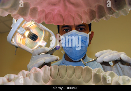 Looking through an open mouth to a dentist practising surgery. Stock Photo