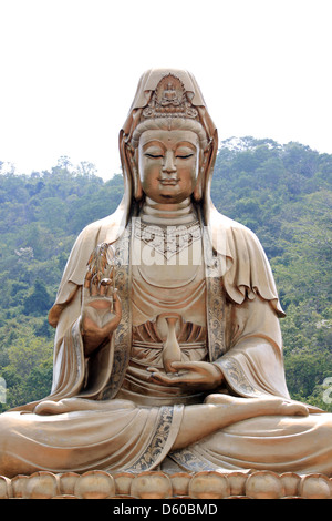 The Chinese deities sculpture of Guan Yin,Made of brass. Stock Photo