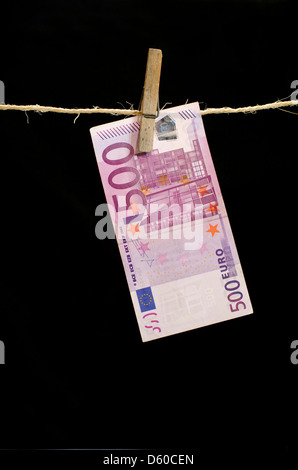 Five 500 hundred euro note drying on a line Stock Photo