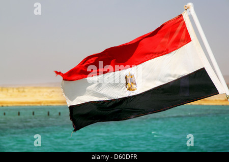 Flag of Egypt on the ship against the sea and sky Stock Photo