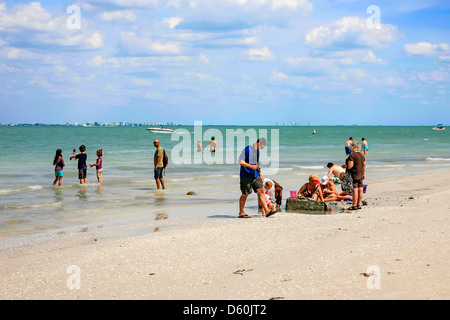 People enjoying Sanibel Island beach on the Gulf of Mexico coastline of Florida Stock Photo