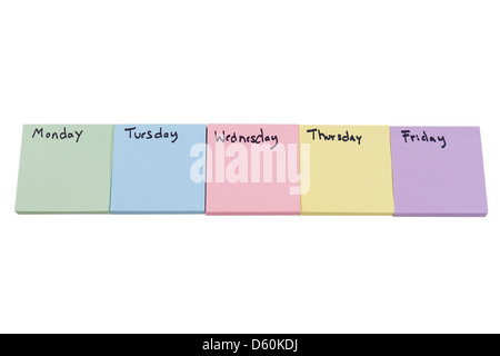 Horizontal photo of multiple color stickers, displaying day of week on each separate color, isolated on white background Stock Photo