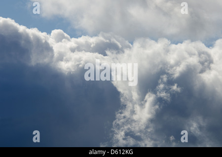 A glimpse of blue sky between gathering storm clouds. Stock Photo