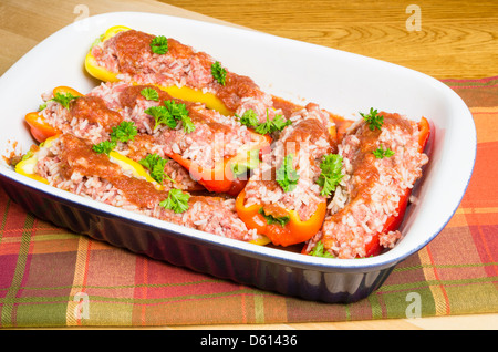 Fresh homemade stuffed peppers in casserole pan ready to bake Stock Photo
