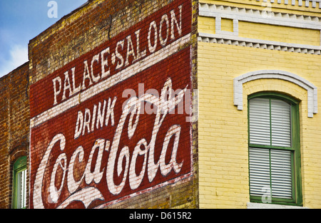 Historical Coca Cola sign painted on brick exterior of Palace Saloon, Centre Street in Fernandina Beach, Amelia Island, Florida Stock Photo