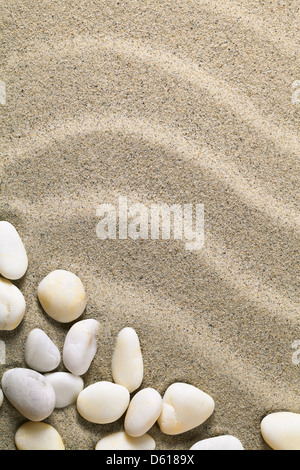 Sand background with stones for summer. Sandy beach texture. Macro shot. Copy space Stock Photo