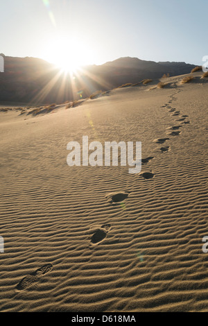 Footprints in the sand of the Eureka Dunes in Death Valley National Park. Stock Photo