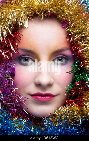 Woman in tinsel Christmas costume Stock Photo