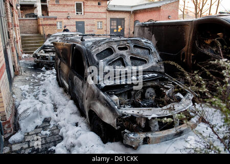 Four burnt out cars are pictured at Koepenicker Street in Berlin, Germany, 16 April 2012. The cars were set on fire on the premises of a company for graffitti removals offering an emergency service on 01 May 2012.  Photo: Robert Schlesinger Stock Photo