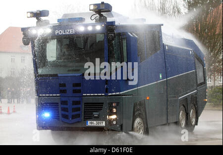 FILE - An archive picture dated 10 February 2011 shows a new type WaWe 10 water gun in action during its handover to the police in Hamburg, Germany. The high tech vehicle costs around one million euro. The Berlin police bought one in October 2011 and could use it if riots should take place on 01 May 2012. Photo: Malte Christians Stock Photo