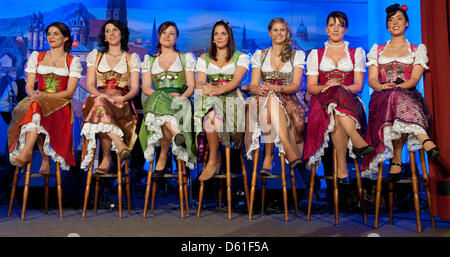 The candidates for the title 'Bavaria's Beer Queen' Victoria Mueller (L-R), Sabrina Liesa Ferber, Lena Schnell, Jennifer Victoria Withelm, Daniela Engel, Barbara Hostmann and Barbara Gailer are pictured at Augustiner Keller in Munich, Germany, 19 April 2012. 21-year-old Hostmann was selected to be the new Bavarian Beer Queen by a jury and votes of the audience. Photo: Sven Hoppe Stock Photo