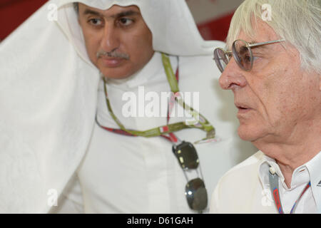 British Formula One Boss Bernie Ecclestone (R) and Zayed Al Zayani, Chairman of the BIC, visit the Media Center before the Formula One Grand Prix of Bahrain at the International Circuit in Sakhir, near Manama, Bahrain, 22 April 2012. Photo: David Ebener dpa Stock Photo