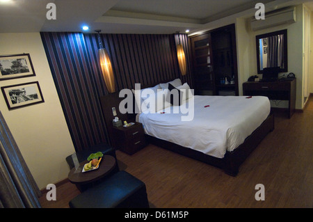 Horizontal wide angle of the interior of a new modern boutique hotel's double bedroom. Stock Photo
