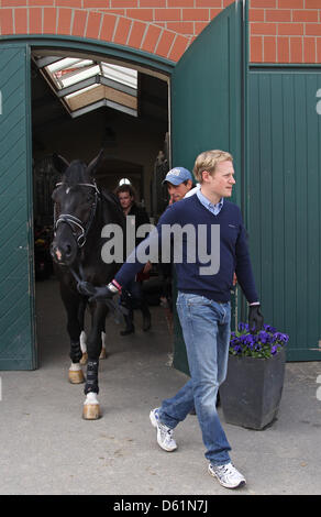 German dressage ride Matthias Rath leads his horse 'Totilas' to the veterinary examination during the Horse & Dreams equestrian event in Hagen Am Teutoburger Wald, Germany, 27 April 2012. Photo: FRISO GENTSCH Stock Photo