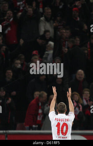(file) - A dpa file picture dated 10 December 2011 shows Cologne striker Lukas Podolski celebrating his 4-0 goal in the Bundesliga match 1. FC Cologne versus SC Freiburg in Cologne, Germany. On 30 April 2012 Podolski announced that he will play for London's Arsenal in the 2012-13 season. Photo: ROLF VENNENBERND Stock Photo