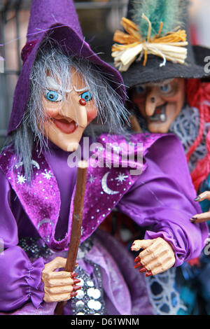 Witch dolls are sold as souvenirs in Thale, Germany, 13 April 2012. Walpurgis Night is a traditional spring festival on 30 April involving depictions of witches and devils. Almost every town in the Harz region has their own Walpurgis Night celebration on the night from 30 April to 01 May. Photo: Matthias Bein Stock Photo