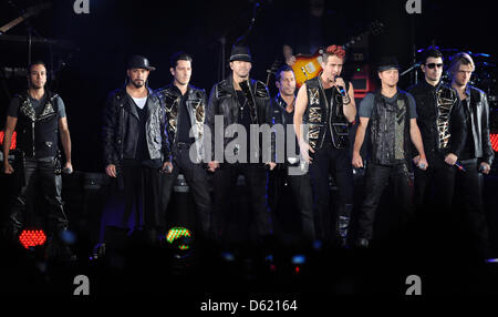 Singers Howie Dorough, Alexander James (AJ) McLean, Jonathan Rasleigh Knight, Donnie Wahlberg, Danny Wood, Joey McIntyre, Brian Littrell, Jordan Knight and Nick Carter of the band NKOTBSB perform on stage during their tour of Germany at O2 World in Berlin, Germany, 07 May 2012. The NKOTBSB Tour is a co-headlining tour between American boy bands New Kids on the Block and the Backstr Stock Photo