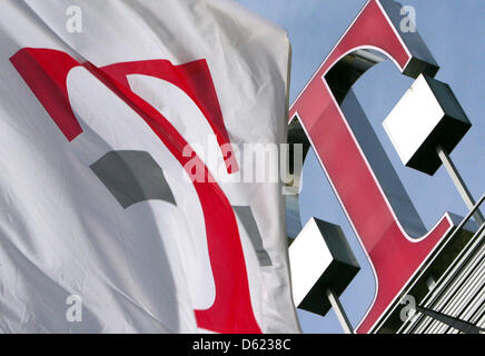 FILE - An archive picture dated 22 February 2007 shows a flag with an oversized T flying in front of the headquarters of Deutsche telekom in Bonn, Germany. Deutsche Telekom will publish their results of the first quarter of 2012 on 10 May 2012. Photo: Oliver Berg Stock Photo