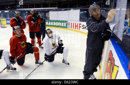 Germany's head coach Jakob Koelliker (r) during the training session for the Ice Hockey World Championships preliminary round match at the Ericsson Globe Arena in Stockholm, Sweden, 11 May 2012. Photo: Peter Steffen Stock Photo