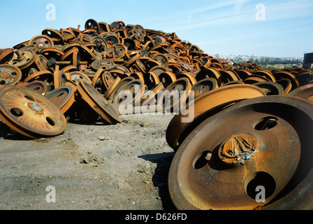 Woodhams of Barry Island train scrapyard in Wales in 1980 with pile of scrap wheels Stock Photo
