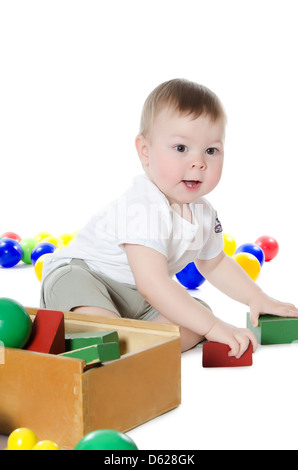 The little boy plays multi-coloured toys Stock Photo