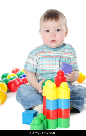 The little boy plays multi-coloured toys Stock Photo