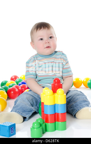 The little boy plays multi-coloured toys Stock Photo