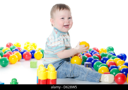 The little boy plays multi-coloured toys Stock Photo