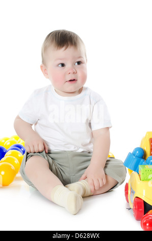 The little boy plays multi-coloured toys Stock Photo