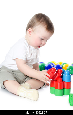 The little boy plays multi-coloured toys Stock Photo