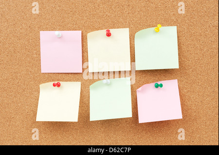 Group of thumbtack and note paper on corkboard Stock Photo