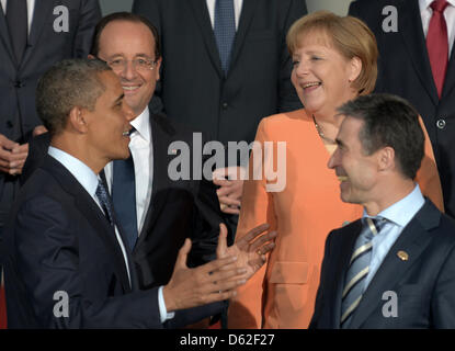 US President Barack Obama (L-R), French president Francois Hollande, German Chancellor Angela Merkel and Nato Secretary General Anders Fogh Rasmussen talk during the family photo at the 2012 NATO Summit group dinner at Soldier Field in Chicago, Illinois, USA, 20 May 2012. World leaders are participating the two-day event to discuss international security and issues related to Afgha Stock Photo
