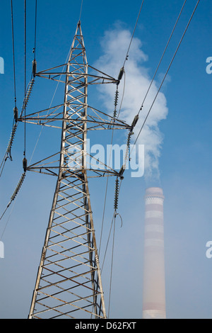 Coal-fired thermal power plant 'Republika' - transmission tower, smoke coming out of industrial chimney Stock Photo