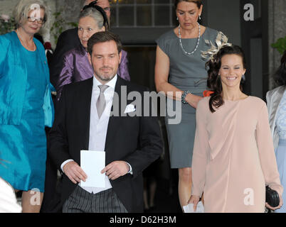 Chris O'Neill (L), the boyfriend of Swedish Princess Madeleine, and Sofia Helqvist, the girlfriend of Prince Carl Philip, arrive for the christening of the Swedish Princess Estelle at the Royal Chapel (Slottskyrkan) in Stockholm, Sweden, 22 May 2012. The daughter of Crown Princess Victoria and Prince Daniel of Sweden was born on 23 February 2012. Photo: Britta Pedersen Stock Photo