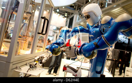 Robot Justin developed by the German Aerospace Center (DLR) is displayed at Automatica 2012 in Munich, Germany, 22 May 2012. In the future, Justin will be remote controlled from the earth to work in space. Automatica takes place from 22 until 25 May 2012. Photo: SVEN HOPPE Stock Photo