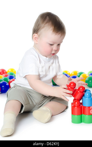 The little boy plays multi-coloured toys Stock Photo