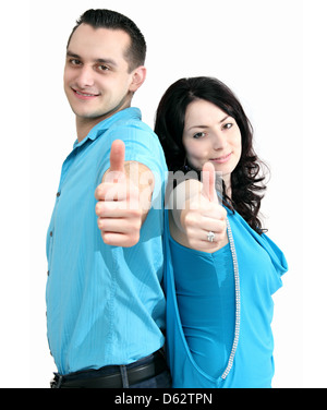 smiling couple shows thumbs-up Stock Photo