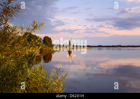 Dutch windmill on lake Stock Photo