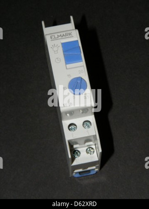 An automatic staircase light powered by a 555 Timer IC, designed to provide lighting when motion is detected on stairs. The system includes various electronic components such as capacitors, resistors, diodes, and a CMOS logic IC to ensure efficient operation of the light circuit for safety and energy-saving purposes. Stock Photo