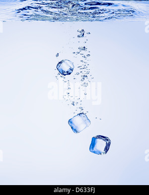 Ice cubes falling in clear water, with bubbles Stock Photo - Alamy