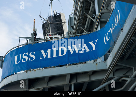 The USS Midway banner hanging on the aircraft carrier Stock Photo