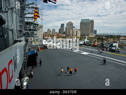 The flight deck of the USS Midway with aeroplanes and visitors to the museum on board. Stock Photo