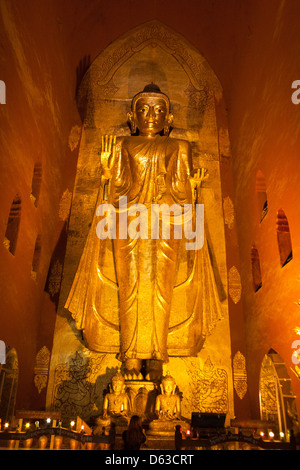 Large golden Gautama Buddha inside Ananda Temple, Old Bagan, Bagan, Myanmar, (Burma) Stock Photo