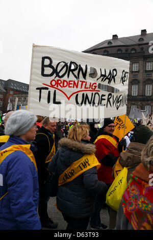 Copenhagen, Denmark. 11th April 2013. 40,000 teachers from all over Denmark demonstrate in front of the parliament building, Christiansborg Palace, against the ongoing lockout of teachers and the government's reform plans to cut teacher preparation time to finance longer school days. Banner text: 'Kids have the right to proper teaching'. Credit:  Niels Quist / Alamy Live News Stock Photo