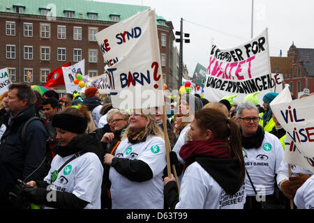 Copenhagen, Denmark. 11th April 2013. 40,000 teachers from all over Denmark demonstrate in front of the parliament building, Christiansborg Palace, against the ongoing lockout of teachers and the government's reform plans to cut teacher preparation time to finance longer school days. Credit:  Niels Quist / Alamy Live News Stock Photo