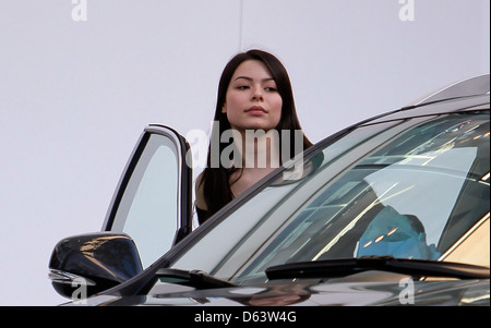 Miranda Cosgrove departs Kitson on Melrose Avenue with two large shopping bags Los Angeles, California - 25.03.11 Stock Photo