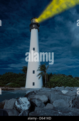 Cape Florida Lighthouse and Lantern in Bill Baggs State Park in Key Biscayne Florida with light glowing at night Stock Photo