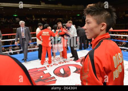 Naoya Inoue, APRIL 8, 2013 - Boxing : Naoya Inoue stands on the ring as Akira Yaegashi of Japan celebrates his victory with his trainer after the WBC flyweight title bout at Ryogoku Kokugikan in Tokyo, Japan. (Photo by Hiroaki Yamaguchi/AFLO) Stock Photo