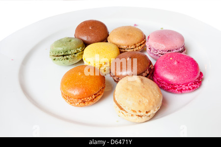 Sweet french Macaroons on white plate clse up Stock Photo